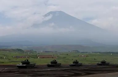 Japanese Ground Self-Defense Force tanks take part in an annual training session with Mount Fuji in the background at Higashifuji training field in Gotemba, west of Tokyo, Japan August 24, 2017